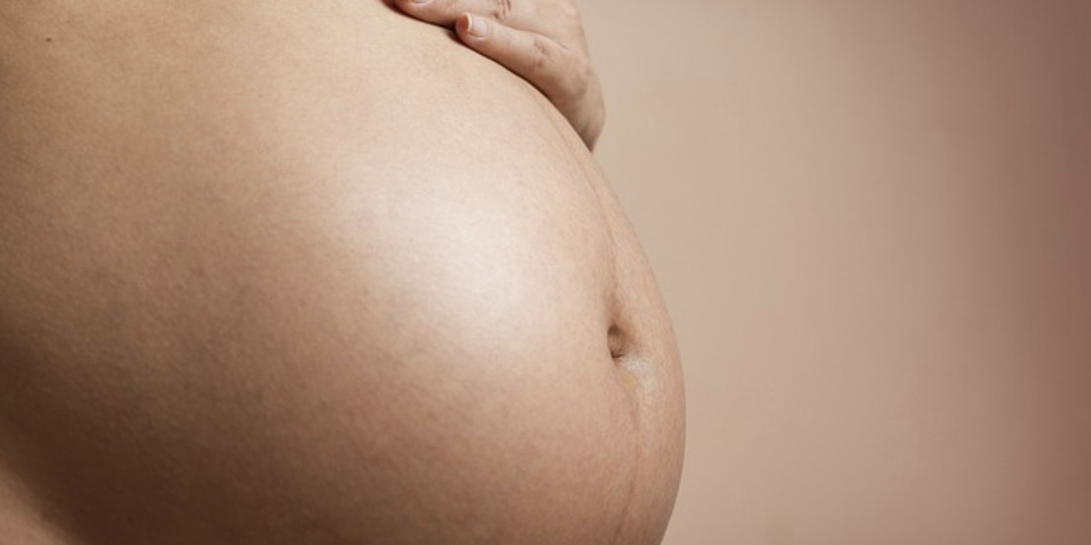 The image of a pregnant woman's stomach.