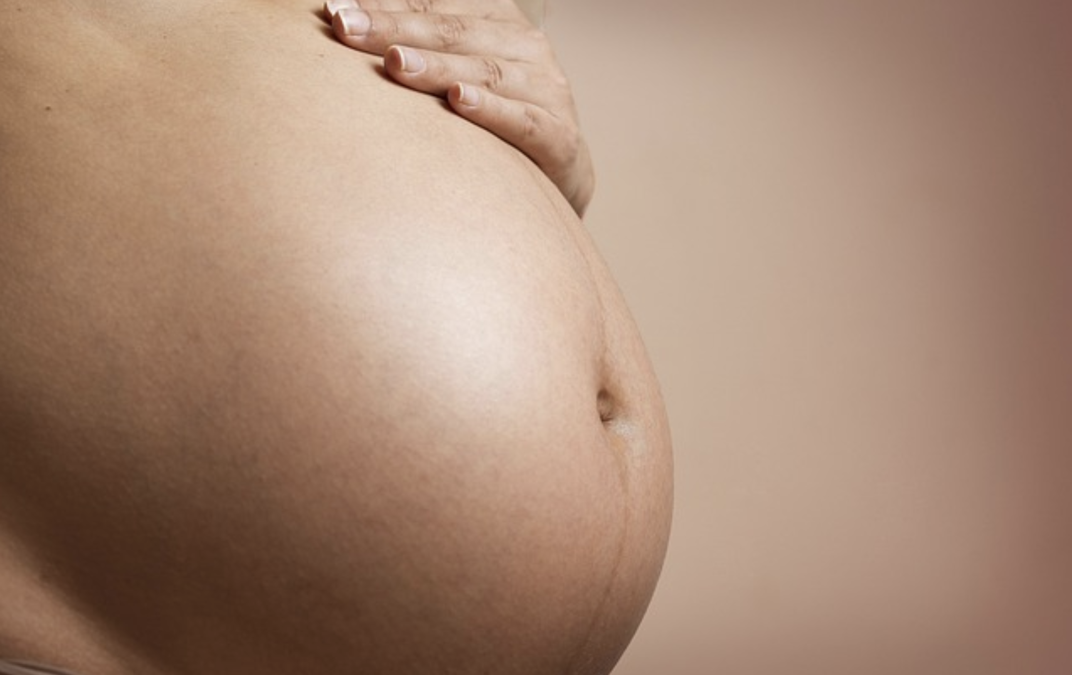The image of a pregnant woman's stomach.
